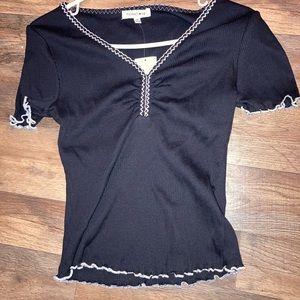 Brand new shirt. Embroidered neck line and lettuce hem.